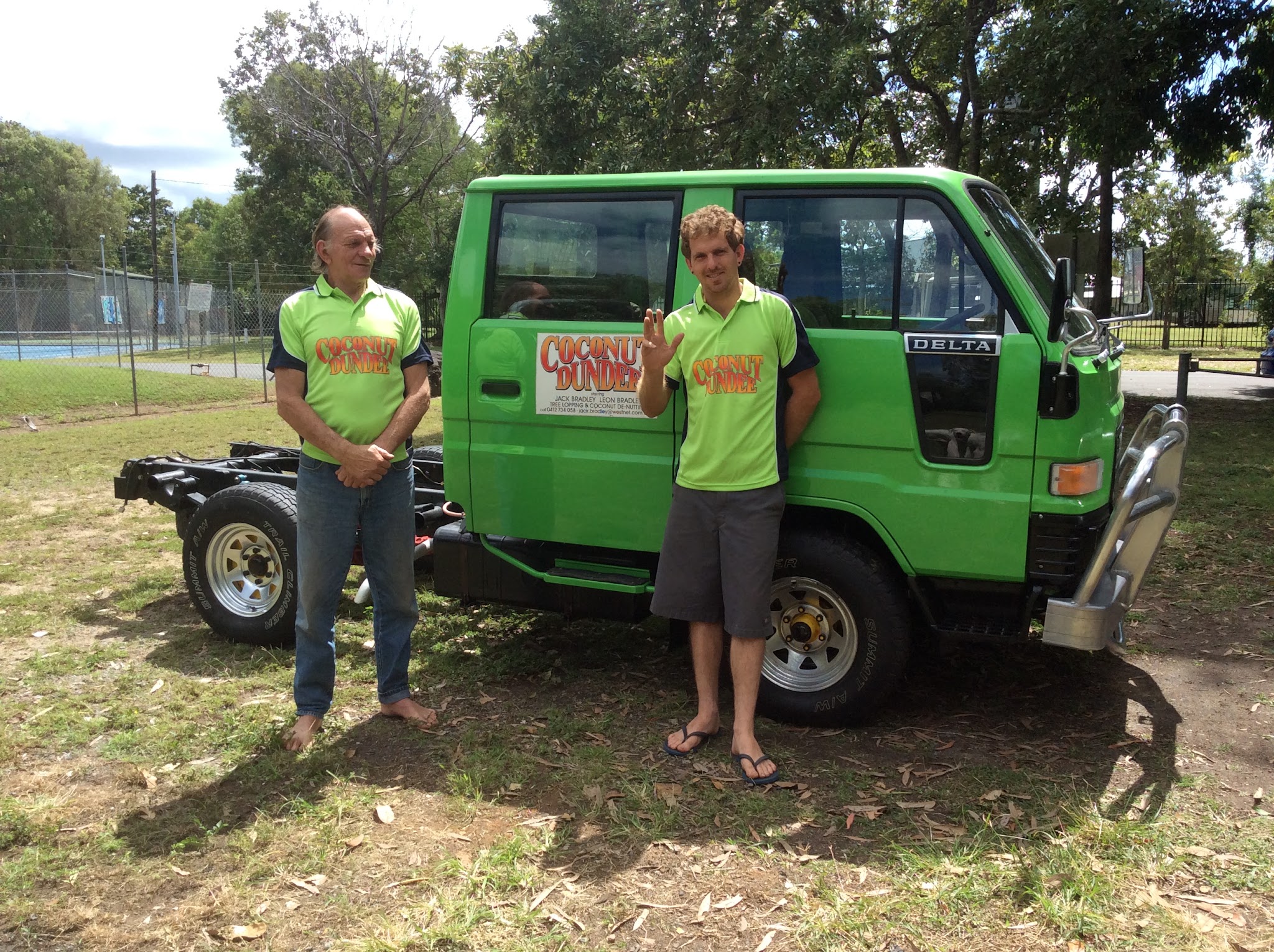 Jack and Leon Bradley in Coconut Dundee shirts beside the green work truck